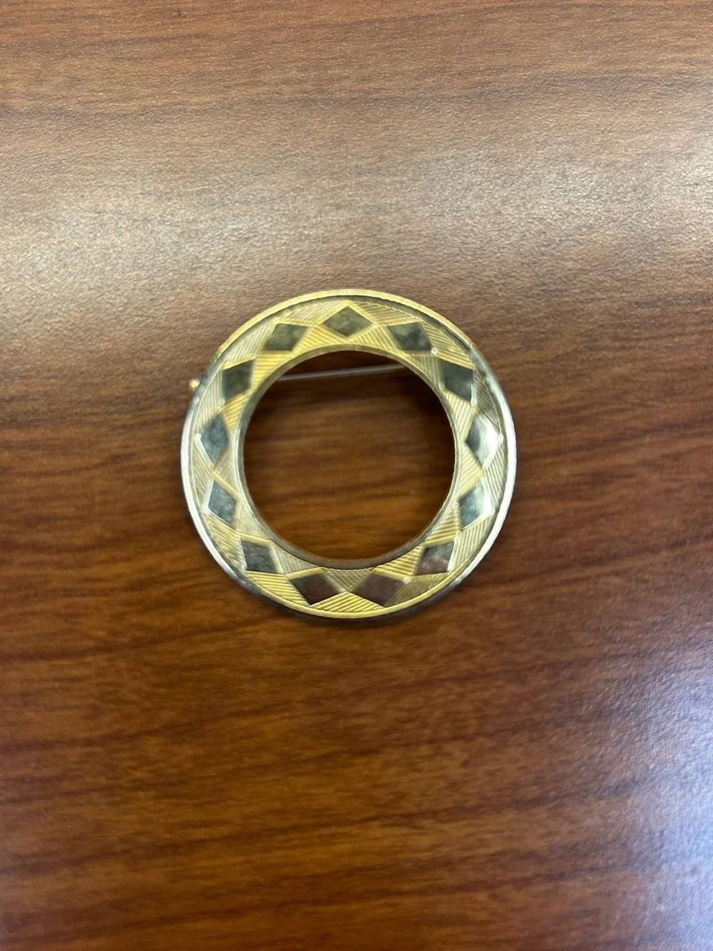 Vintage Gold-Tone Circular Ring Brooch with diamond pattern and textured